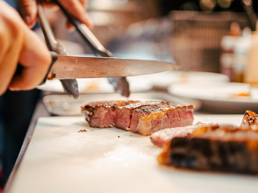 Steak being carved tableside at Brontë
